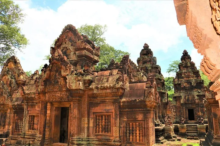 Elaborate red sandstone architecture and towers of Banteay Srei temple